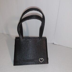 Claires: small evening bag with Rhinestone heart.